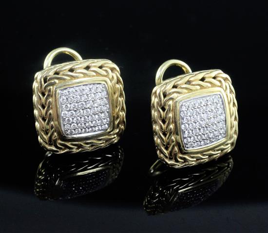 A modern pair of 18ct and pave set diamond earrings.